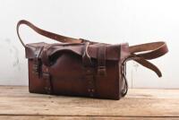 TOOL BAG: A veteran and vintage brown solid leather tool bag with shoulder strap