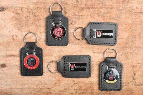 AUSTIN: A collection of five unused enamled key chains including Austin Cambridge, Healey, Mini and two Rover key chains