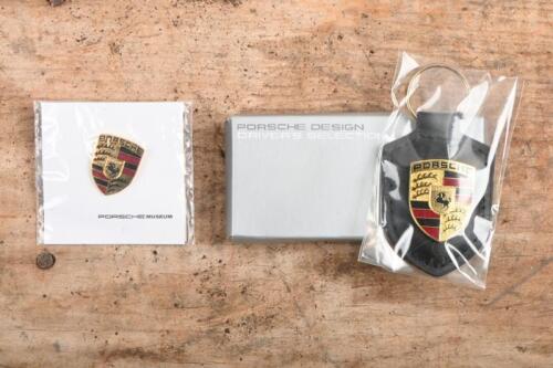 PORSCHE: An official Porsche key ring along with small Porsche pin style badge