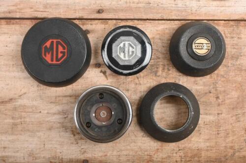 MG: A collection of predominantly 'MG' horn pushes and associated items