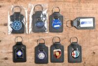 KEYRINGS: A collection of eight enameled keyrings for mostly European marques including Mercedes, Porsche, Alfa Romeo, Fiat and others