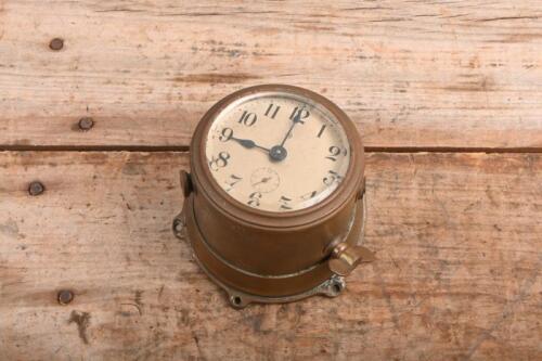 CLOCK: A vintage ANSONIA angled dash mounted clock in brass