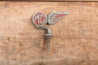 MG: An early MG car emblem
