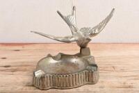 SWALLOW: A Standard Swallow cars showroom ashtray, later to become Jaguar. Original patina