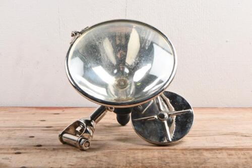 SPOTLIGHT: A spotlight with rear view mirror. Circa 1920s/1930s