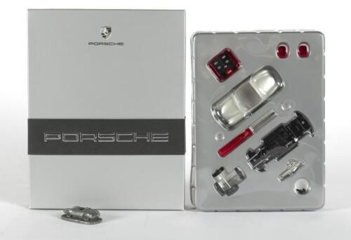 PORSCHE: A Porsche 356 roadster Schuco model kit, 1:43 scale with small 550 spyder desk ornament