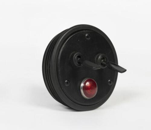 GAUGE INSERT: A gauge insert with warning light and two on-off switches