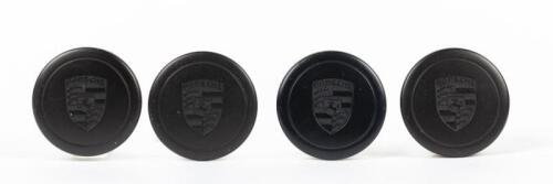 FUCHS: A set of Fuchs Porsche wheel centre caps, black, push on type.