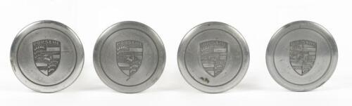 CENTRE CAPS: A set of four silver Porsche Fuchs wheel centre caps