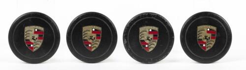 FUCHS: A set of four Porsche Fuchs centre caps, black with painted centres, push in type.