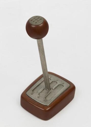 GEARS: A desk piece in the form of manual gearbox with a pen as the shifting lever