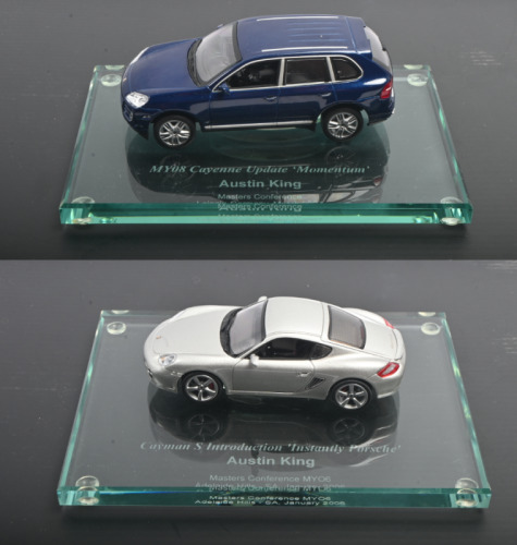 AUSTIN KING: Two 1:43 scale Paul's Model Art/MINICHAMPS&nbsp;models as presented to Austin King for various events. Cayenne & Cayman S models
