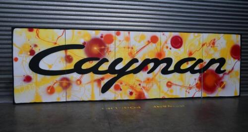 CAYMAN: A huge 5-panel Porsche factory promotional display as used for the launch of the Porsche Cayman in Australia, air brushed on stretched canvas adhered to timber frame; display measures 607.5cm wide, 183 cm high, 3.5cm wide.