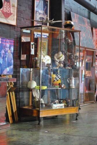 CABINET: An antique upright brass and timber display case. Measures 198.5cm high, 121.5 cm wide, 66.5cm deep (Updated Description & Photos)
