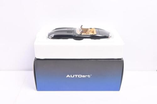 JAGUAR: A 1:18 scale AUTOart Jaguar E-Type Roadster Series 1 3.8 in black (73605). CoA with Serial No.: '0221'