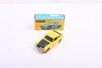 CORGI: A Corgi MGC GT "Competition Model" (345). Yellow with black bonnet. Model with 'NEW MGC G.T.' blue and yellow carded picture box