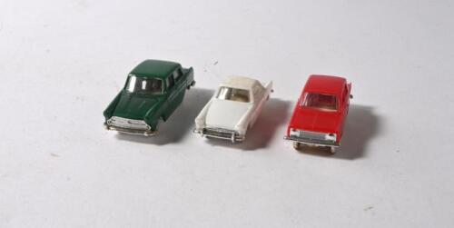 TRI-ANG MINIX: Three English made Tri-ang MINIX 1:87 HO scale model plastic cars. No.3 VAUXHALL VIVA in red, No.5 AUSTIN A60 in dark green & No.7 SUNBEAM ALPINE in white