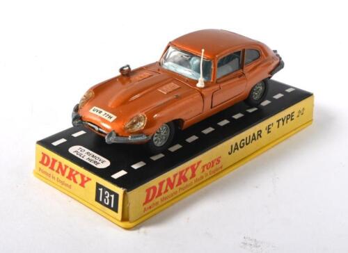 JAGUAR: A Dinky 131 Jaguar Type E - metallic bronze, pale blue interior, white plastic aerial, chrome trim, cast wire wheels - Near Mint - lovely bright example in an Excellent rigid perspex case