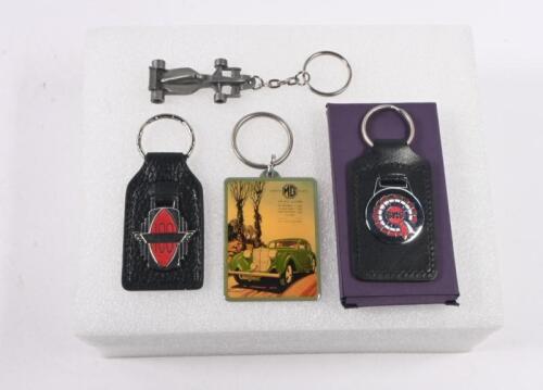 FOBS/KEY RINGS: Four fobs and keyrings. 'Austin-Healey 100', 'BMC', 'MG SAFETY FAST! - THE M.G. 1.5 LITRE' key ring. Formula 1 car key ring