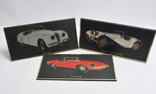 JAGUAR: Three retro plastic plaque desk signs featuring various Jaguar models. '1937 SS 100 OPEN TWO SEATER', 'XK 120 1948', '"E" TYPE 1961' desk signs. Made for UNIPART LEYLAND CARS LTD