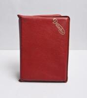 DAIMLER: A red leather 'Daimler' pouch containing Daimler and Jaguar Driver Handbooks, Maintenance Book & Service Record. 1979 'Daimler SOVEREIGN 4.2, VANDEN PLAS 4.2' (Publication Part No. AKM 4174 Edition 2), and 1980 'Daimler DOUBLE SIX 5.3, VANDEN PLA
