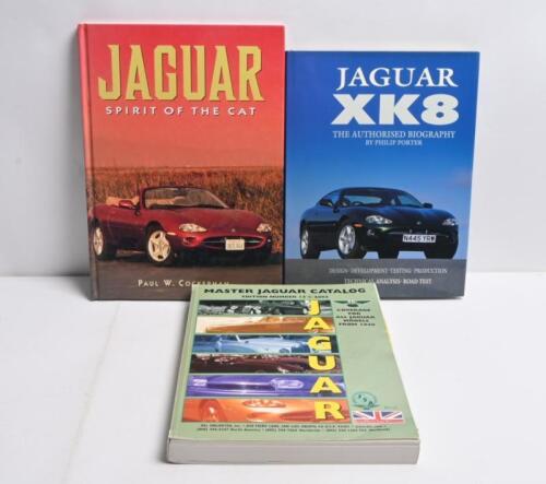 JAGUAR: Two hardcover books and softcover catalogue detailing the Jaguar marque. 'JAGUAR - SPIRIT OF THE CAT' by Paul W. Cockerham