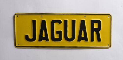 JAGUAR: A set of yellow and black 'JAGUAR' number plates. No rights to display