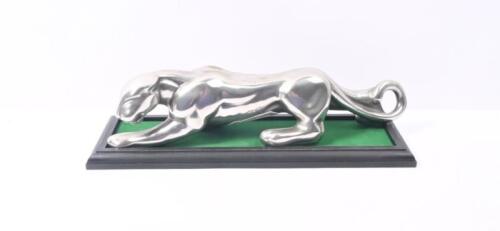 BRYSON'S: A circa 1960s metal showroom figure of a prowling&nbsp;jaguar. With affixed label &lsquo;Property of Bryson Ind. Ltd&rsquo; 9.5cm high, 37cm wide