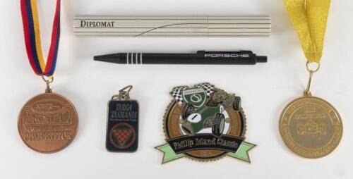 COMPETITOR EVENTS: A small group of medallions and keyrings for various car racing events. 2003 CLASSIC ADELAIDE, 2006 HISTORIC SANDOWN 1st in Class and 2014 Phillip Island Classic medallions