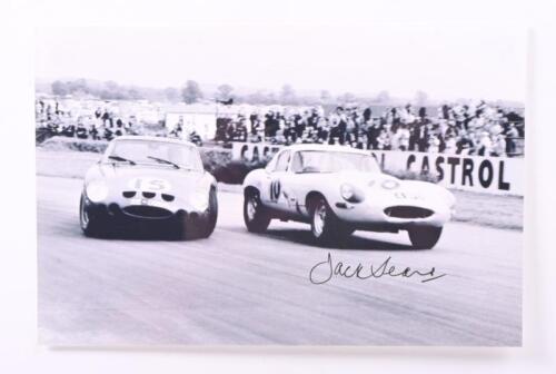 SEARS: A black and white image of Jack Sears racing the John Coombs Jaguar E-Type at Goodwood TT 1963. Image signed by Jack Sears