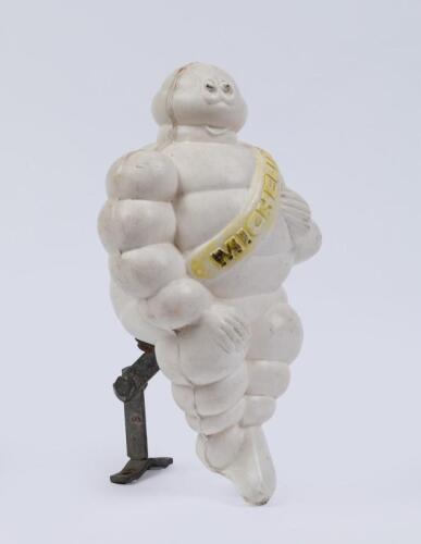 MICHELIN: A c1960s-1970s small plastic Michelin Bibendum truck mount figure with original bracket