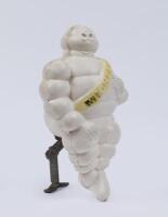 MICHELIN: A c1960s-1970s small plastic Michelin Bibendum truck mount figure with original bracket