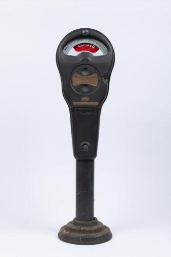 PARK-O METER: A vintage Australian coin operated parking meter by 'H. Rowe & Co' mounted to a cast base on a short pole. 69cm tall