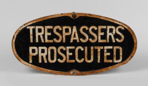 VR: A Victorian railways heavy cast 'Trespassers Prosecuted' sign, 31cm high, 61cm wide.