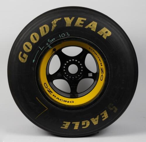 BENETTON: A Benetton Oz Racing F1 wheel & tyre with round glass top for coffee table use, wheel believed to be from Schumacher's B-194