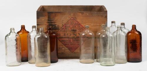 CHESTER: A interesting vintage 'Chester Petrol' wooden box by Tide Water Oil Company New York, distributed by Universal Oil Company Limited Sydney New South Wales, with a selection of glass kerosene bottles