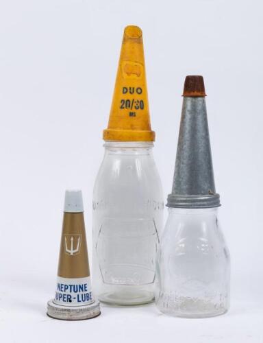 NEPTUNE: A superb original Neptune 'Super Lube' tin oil bottle top, complete with white dust cap, along with two modern oil bottles, one with plastic Golden Fleece Duo 20/30 MS top