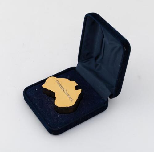 DAIMLER/CHRYSLER: A interesting 24carat gold plated 'Daimler Chrysler' Australian souvenir paper-weight in case