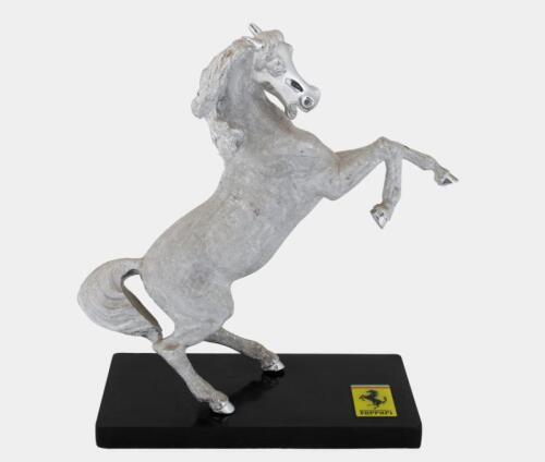 PRANCING HORSE: A interesting metal prancing horse sculpture in Ferrari style, mounted to base.