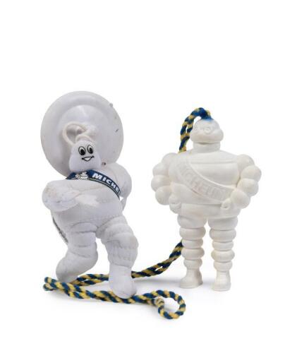 MICHELIN: Two small hanging Michelin bibendum figures including plastic standing bib, as well as 2000s fabric plush running bib