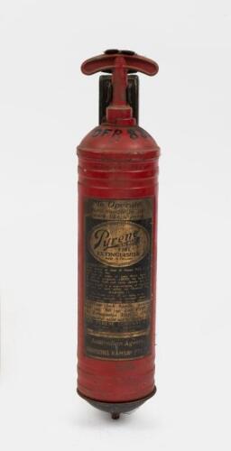 FIRE EXTINGUISHER: A vintage red 'Pyrene' fire extinguisher made in England, distributed in&nbsp;Australia by agent Harrisons Ramsay, with mounting bracket affixed, still full with liquid