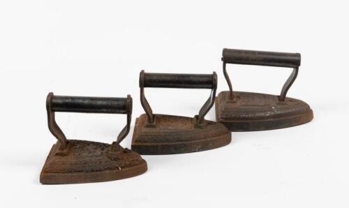 IRONS: A selection of three vintage cast iron irons, sizes 5,6, & 8.