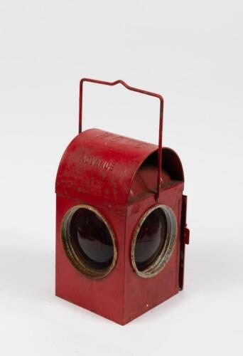 LAMP: A vintage red hand held lamp by Chalwyn with stamping to top 'HGCC'