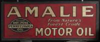 AMALIE: A excellent original tin Amalie Motor Oil sign with early 'From Nature's Finest Crude' slogan. Sign mounted in a wooden frame. 123cm wide, 50cm high