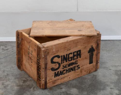 SINGER: A timber Singer Sewing Machines delivery crate, measures 55cm wide, 41cm deep, 37cm high