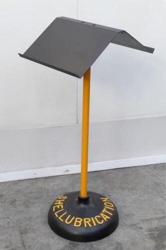 SHELL: A restored Shell Lubrications book/manual stand. Features cast iron base, approx 104cm tall.