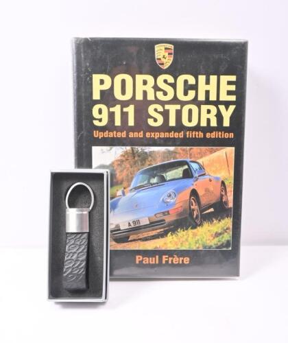 911: Two Porsche 911 related items including 'Porsche 911 Story' by Paul Frere and a new boxed Porsche design driver's selection 911 keyring/hang tag.