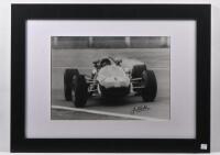 BRABHAM: A framed black and white photograph of Jack Brabham's BT19, autographed to lower right by Brabham.&nbsp;