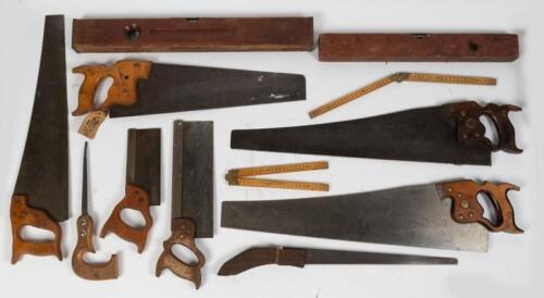 SAWS: A selection of vintage hand saws including early Disston and Warranted Superior saws.