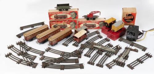 FERRIS TRAINS: A selection of early Ferris electric&nbsp;tin plate trains including F49 Parcel Van, two F48 Trailer Cars, Transformer & Control Unit, sections of track and more